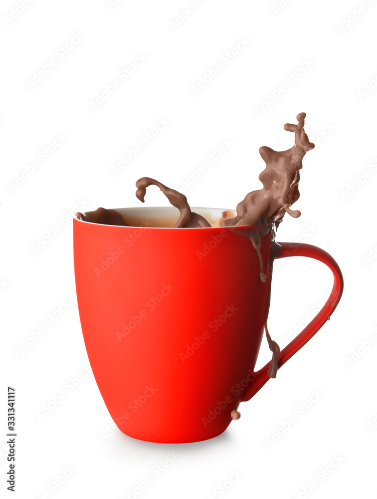 Cup with splashing cocoa drink isolated on white