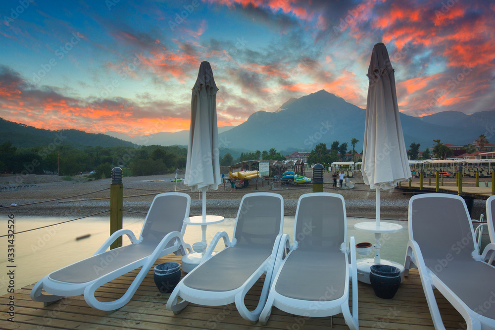 Amazing sunset on the coast of Turkish Riviera with Mount Tahtali in background, Tekirova