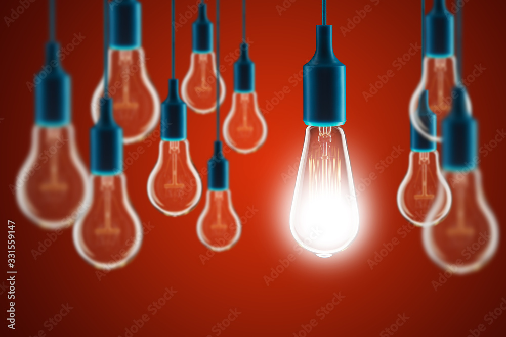 Idea and leadership concept - bulbs on the red background