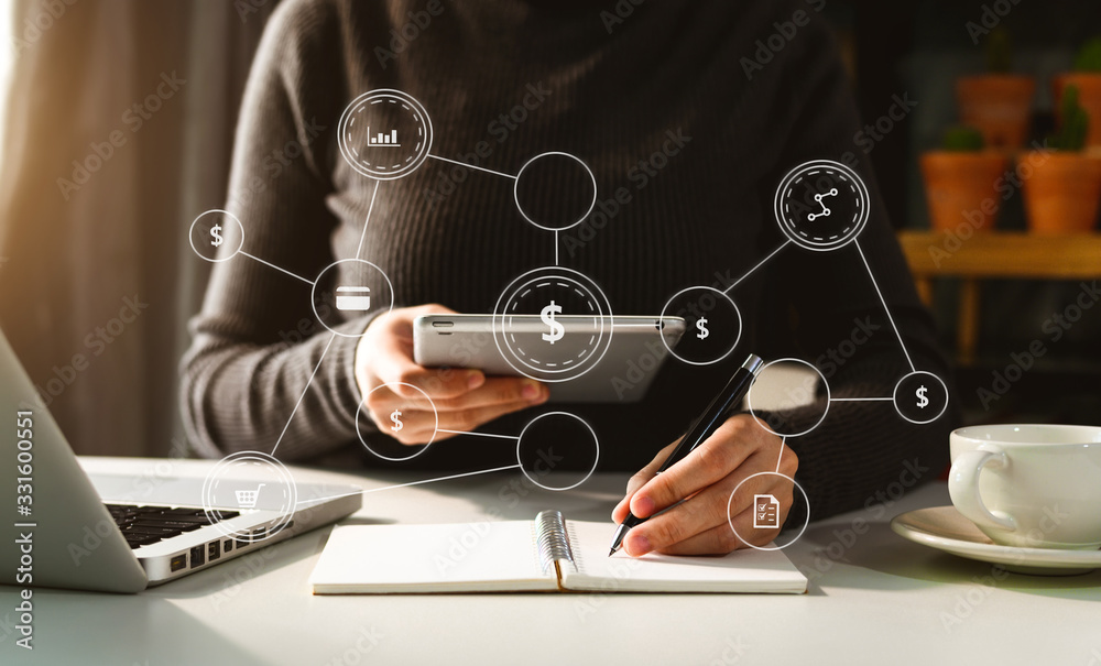  Businesswoman working with smart phone and laptop and digital tablet computer in  office with digit