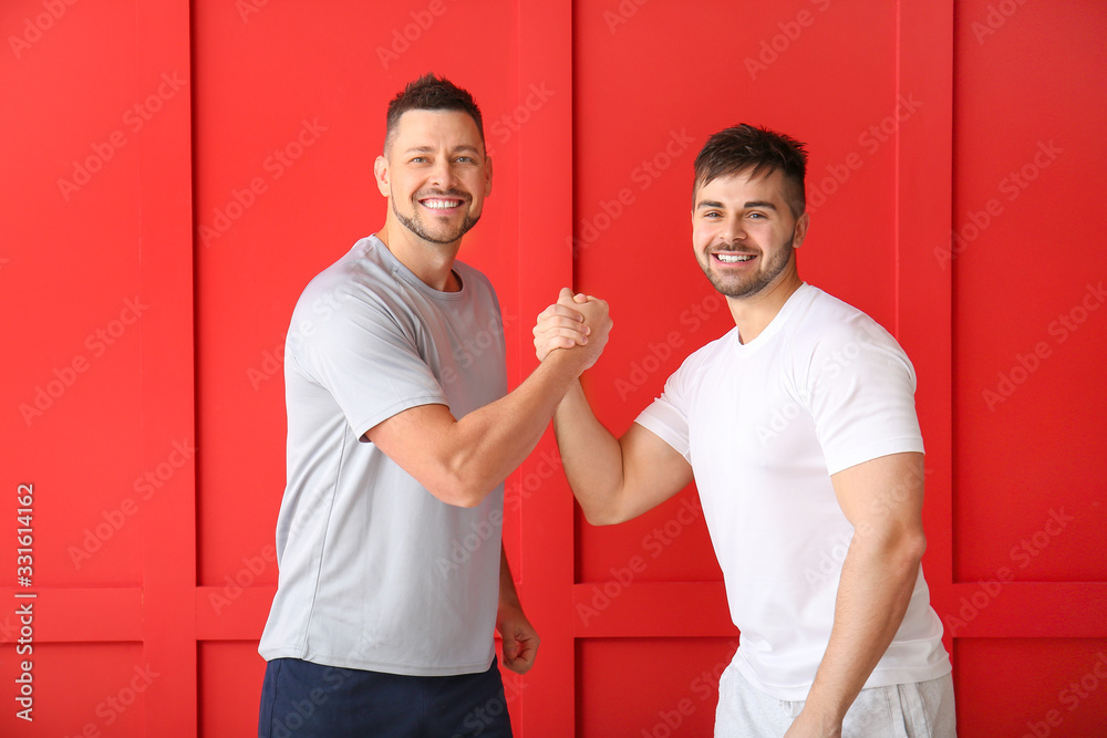 Portrait of happy friends on color background