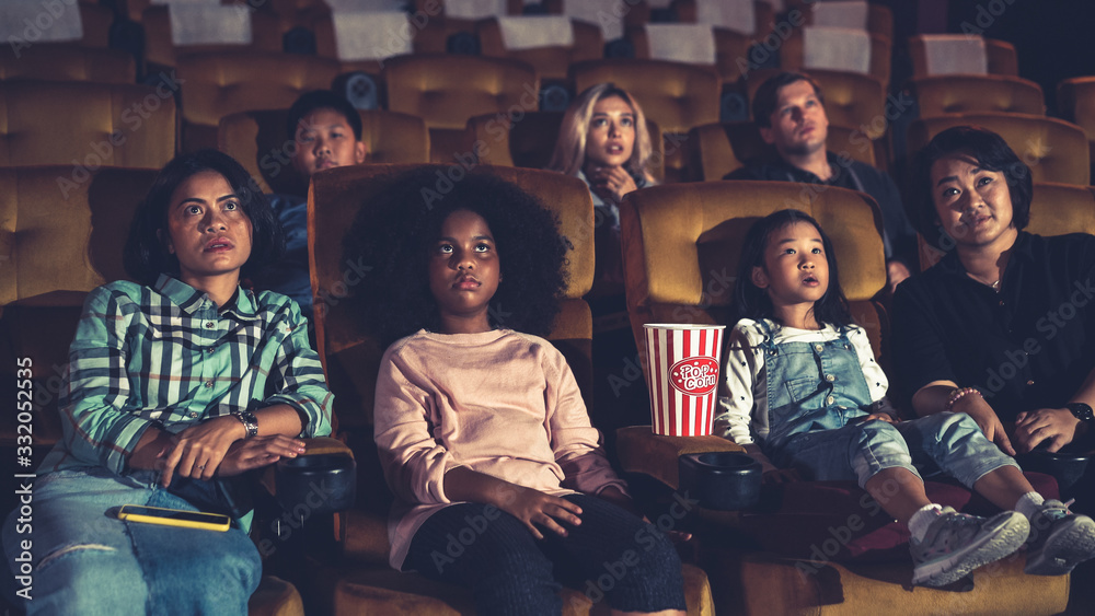 People audience watching movie in cinema theater.