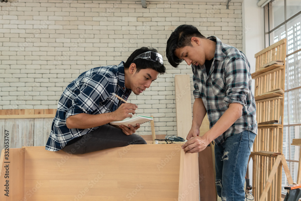 Carpenter working on wood craft at workshop