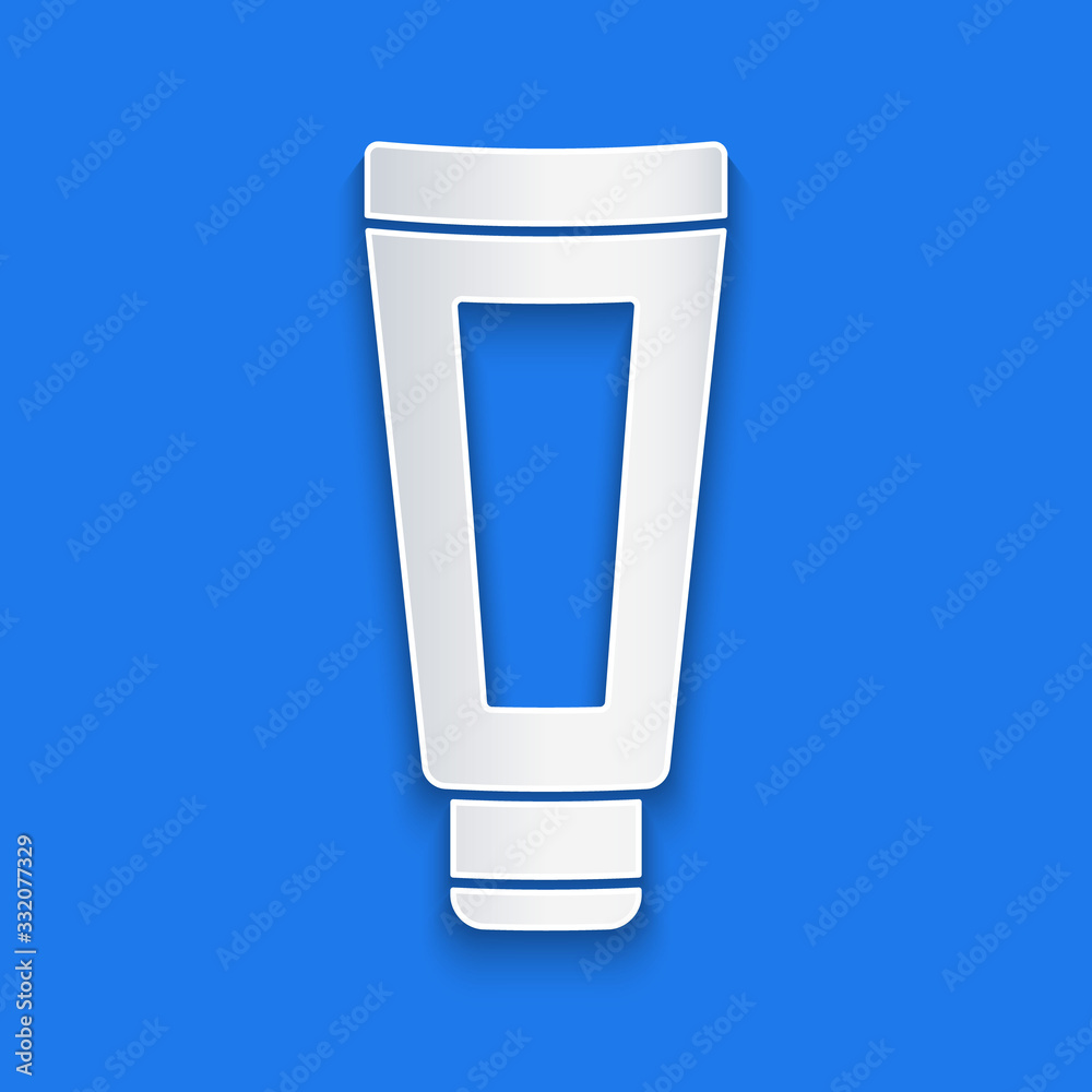 Paper cut Cream or lotion cosmetic tube icon isolated on blue background. Body care products for men