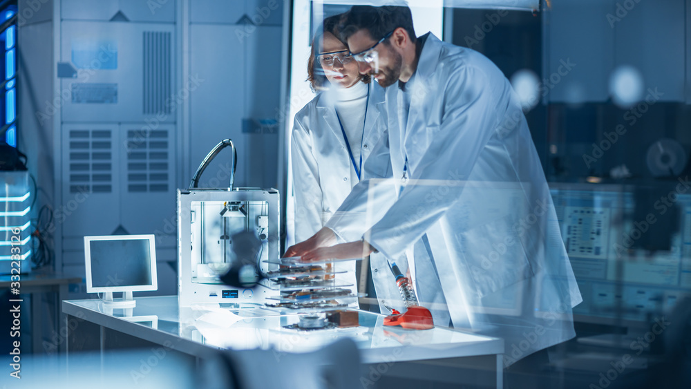 Diverse International Team of Industrial Scientists and Engineers Wearing White Coats Working on Hea