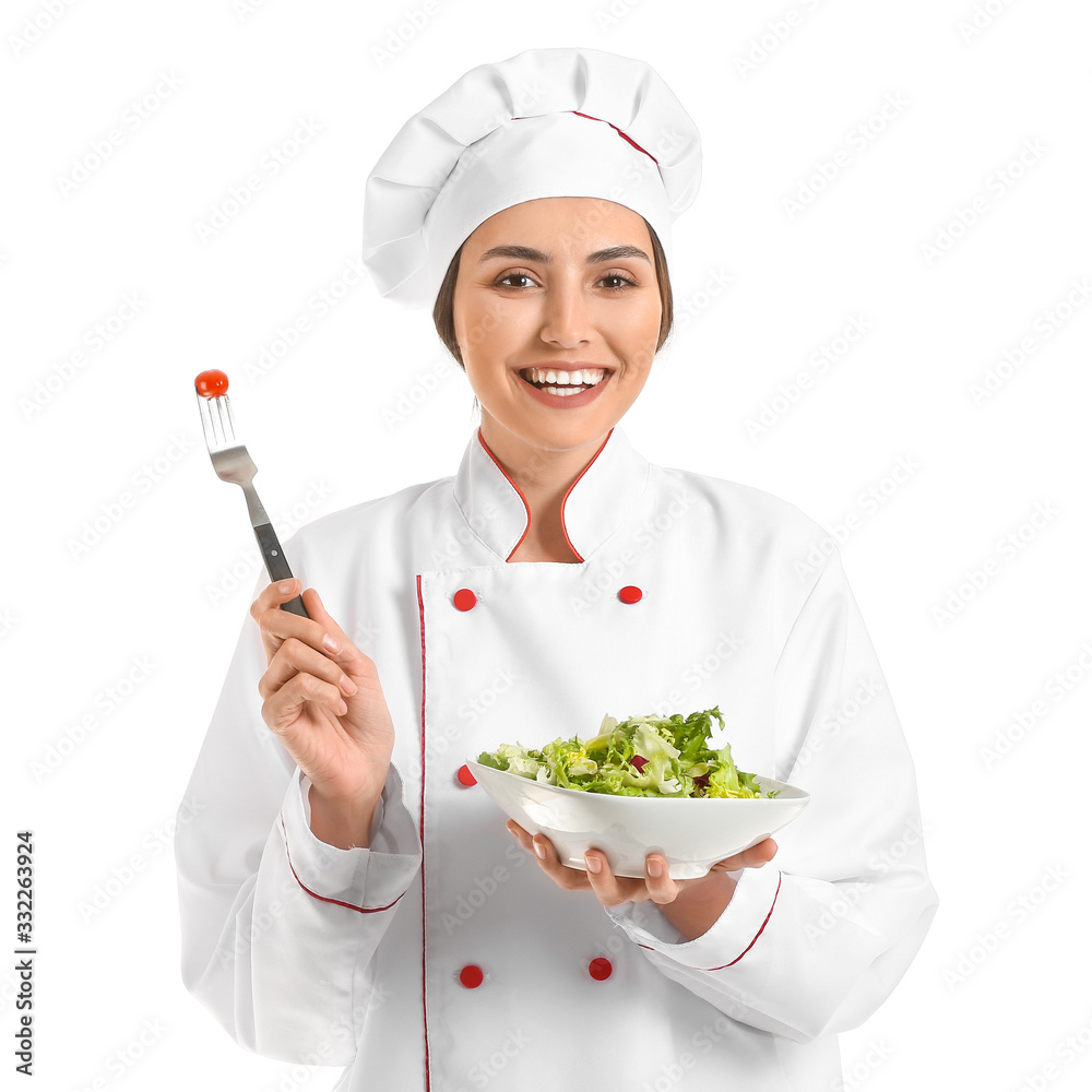 Portrait of female chef with salad on white background