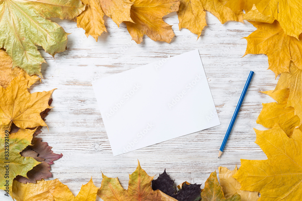 White paper sheet and pencil lies on desk