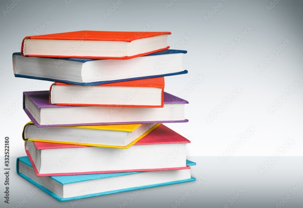 Stack of colorful books collection on the desk