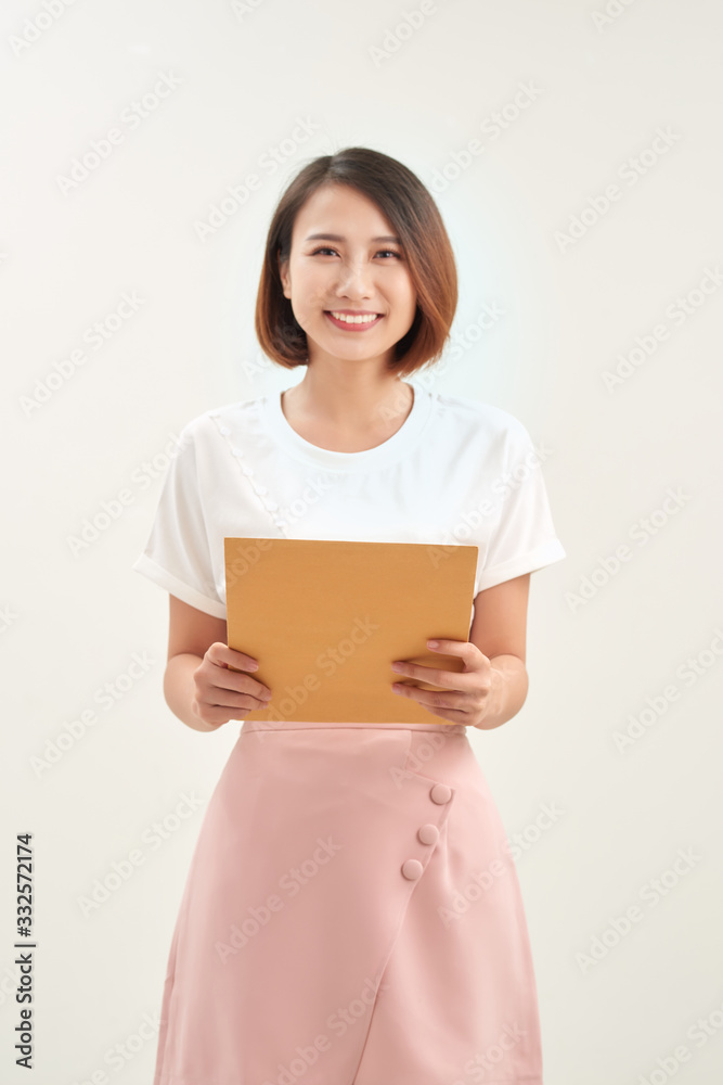 Woman hand holding brown envelope on white background