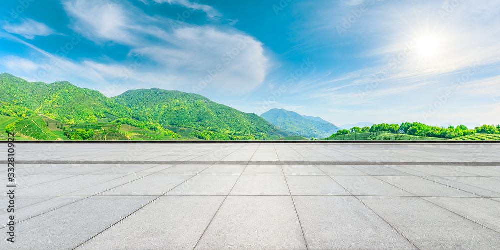 Empty square floor and green tea mountain nature landscape on sunny day,panoramic view.