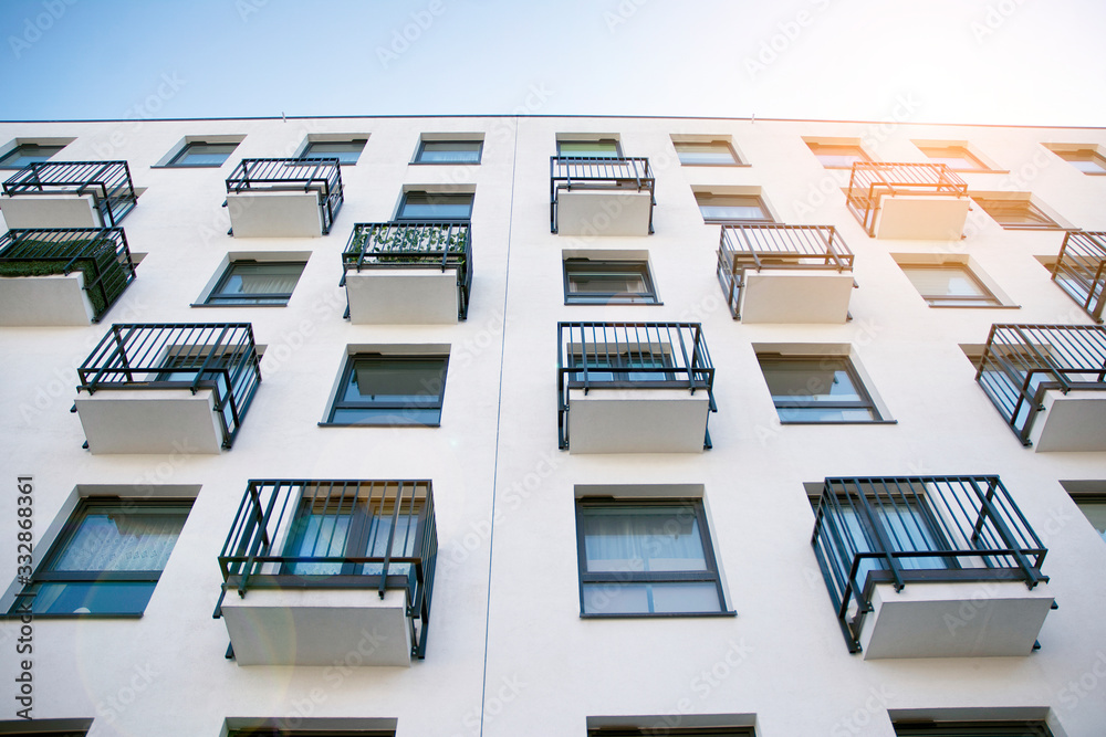 Modern apartment building flat estate concept. Outdoor residential facility at sunset and sunrise.