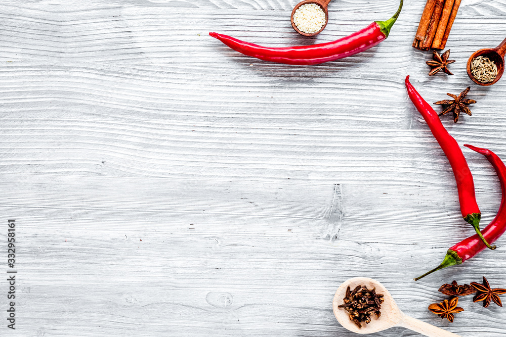 Dry colorful spices, chili pepper on kitchen light table background top view mockup