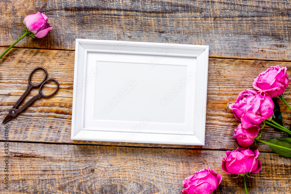 pink peony and frame for present on wooden background top view mockup