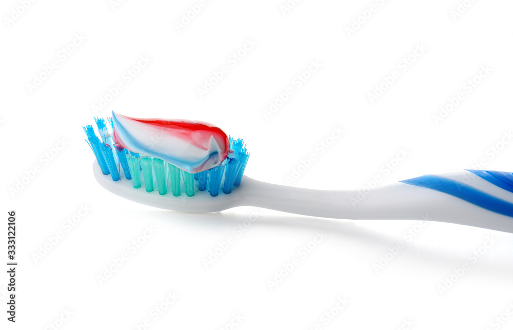 Tooth brush with paste on white background