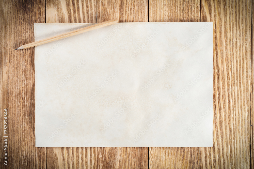 Sheet of paper lying on wooden table