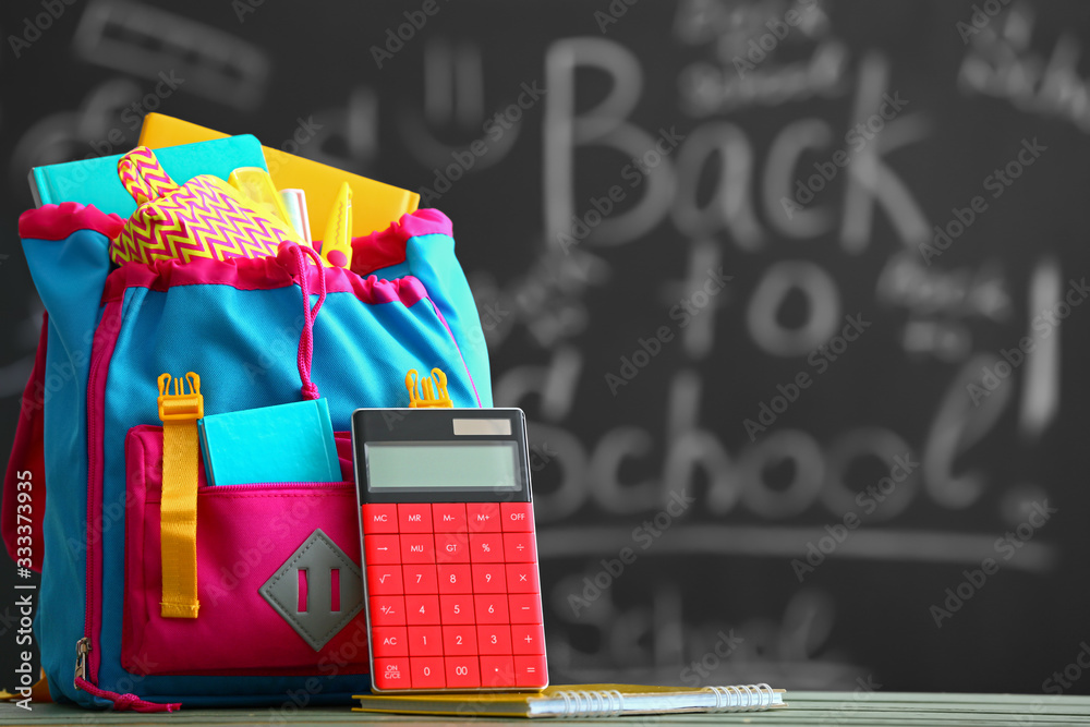 School backpack on table in classroom