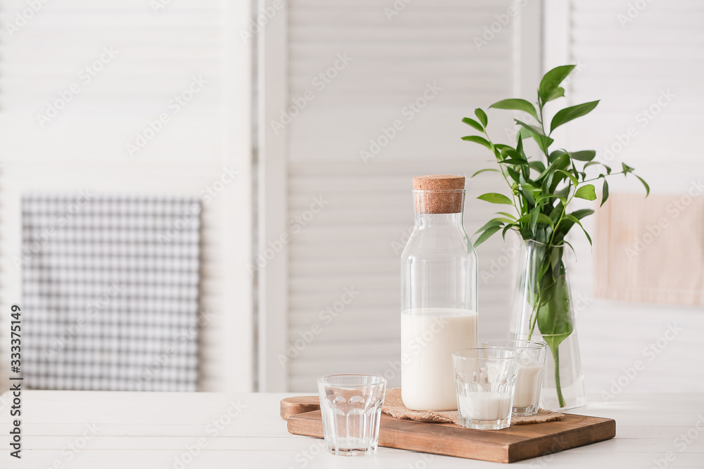 Glassware of fresh milk on table