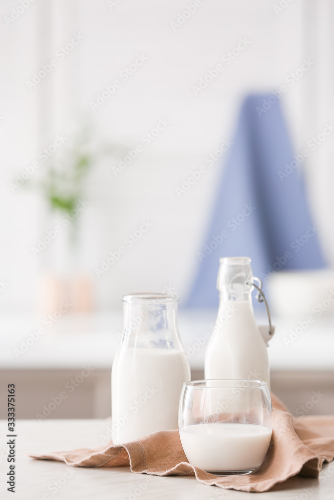 Glassware of fresh milk on table