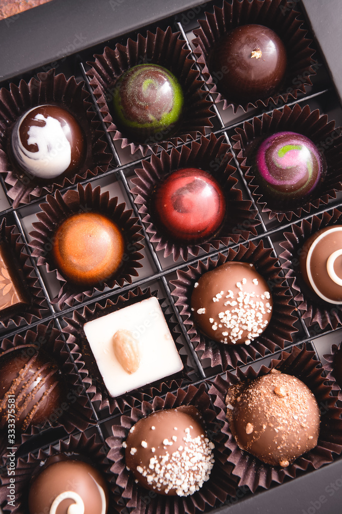 Box with delicious candies, closeup