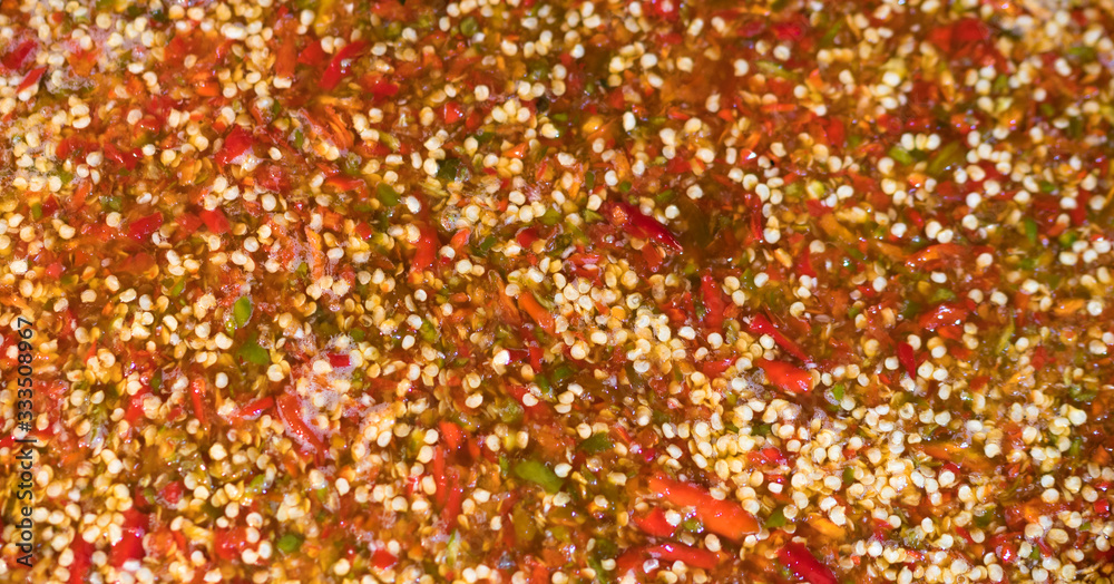 Spicy Seafood Dipping Sauce in a large bowl on the Thailand city streetsclose up photo. Asian street