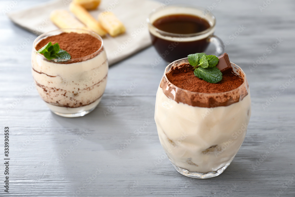 Tasty tiramisu on wooden table