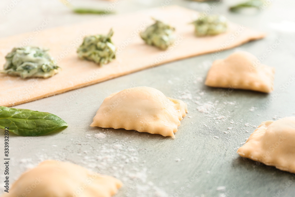 Preparing of tasty ravioli on table