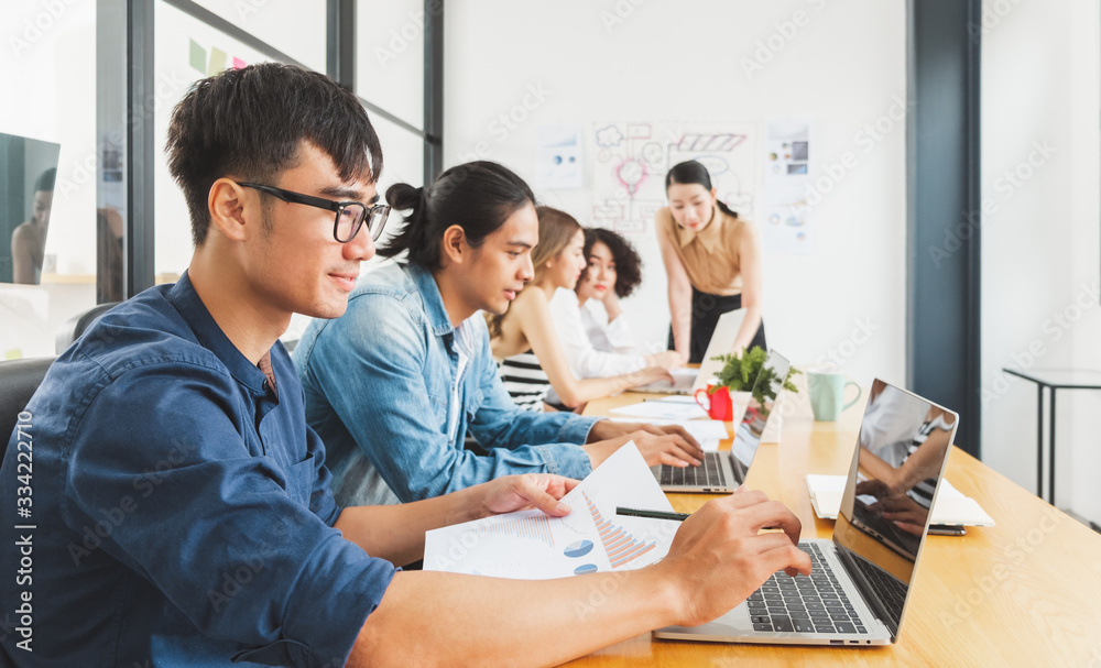 Asian business people working with laptop, searching data for business startup plan and strategy