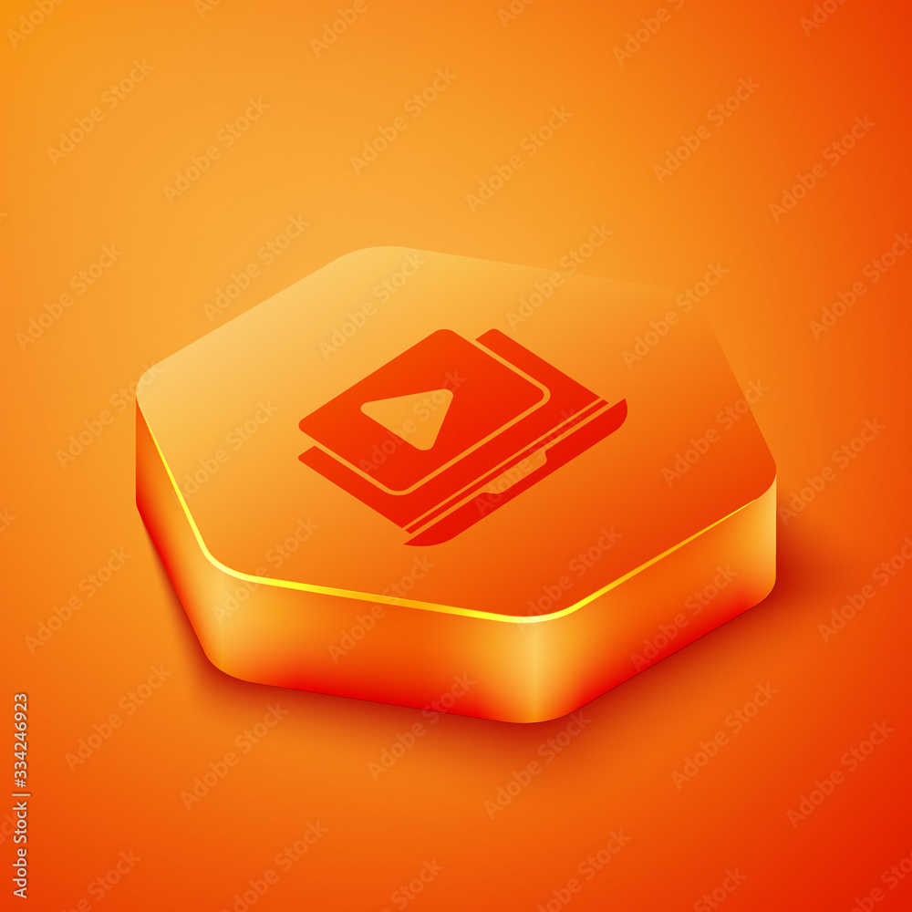 Isometric Online play video icon isolated on orange background. Laptop and film strip with play sign