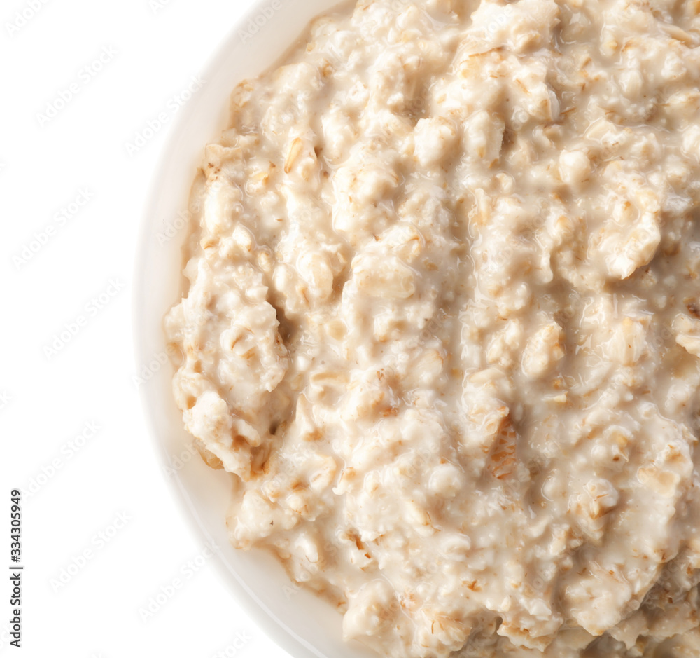 Bowl with tasty oatmeal on white background