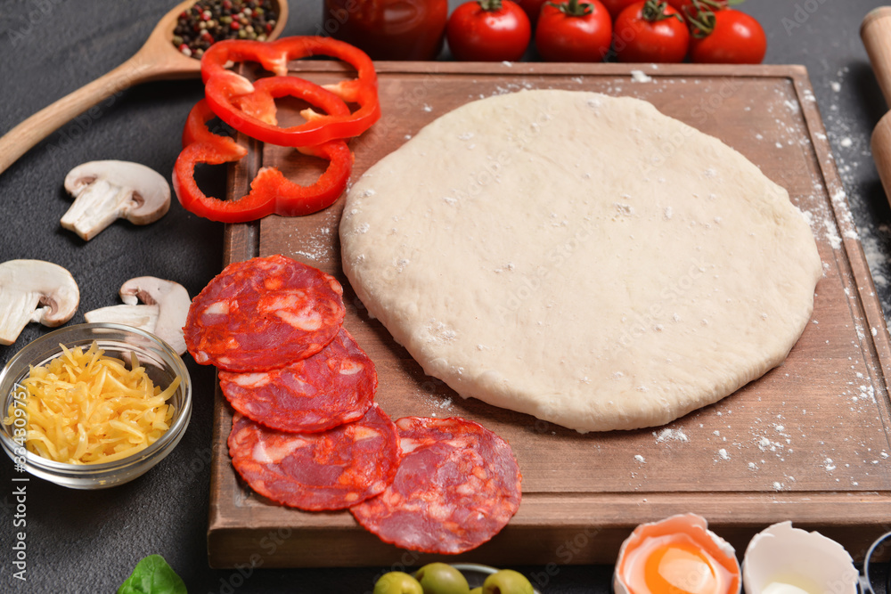 Ingredients for tasty pizza on table