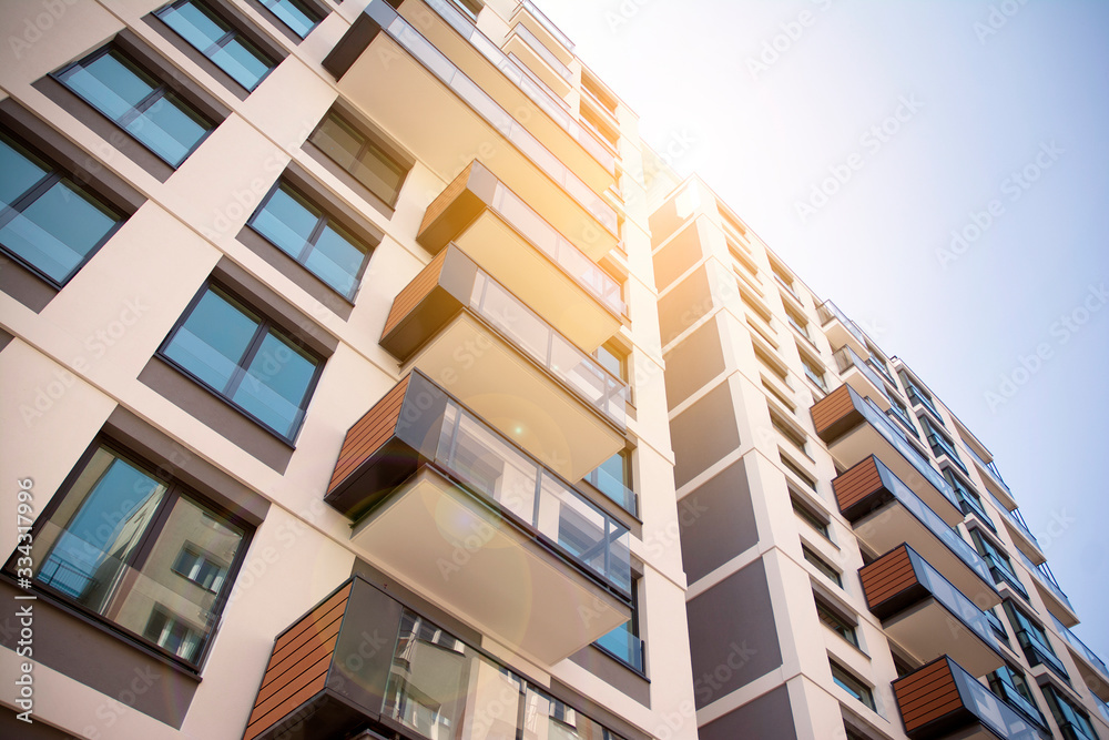 Apartment residential house and home facade architecture and outdoor facilities. Blue sky on the bac