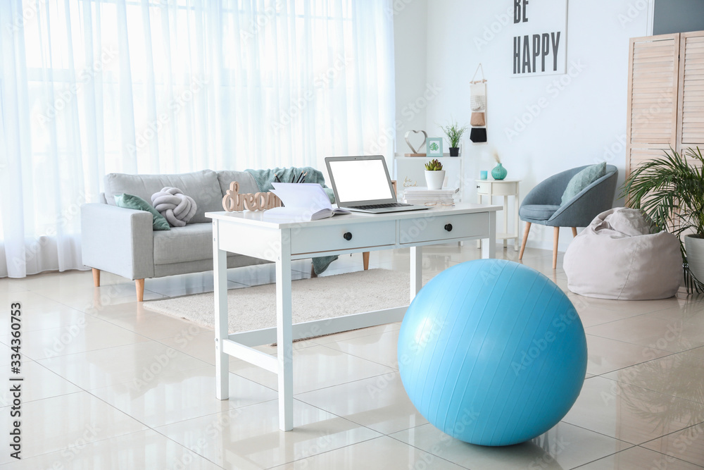 Fitness ball near workplace at home