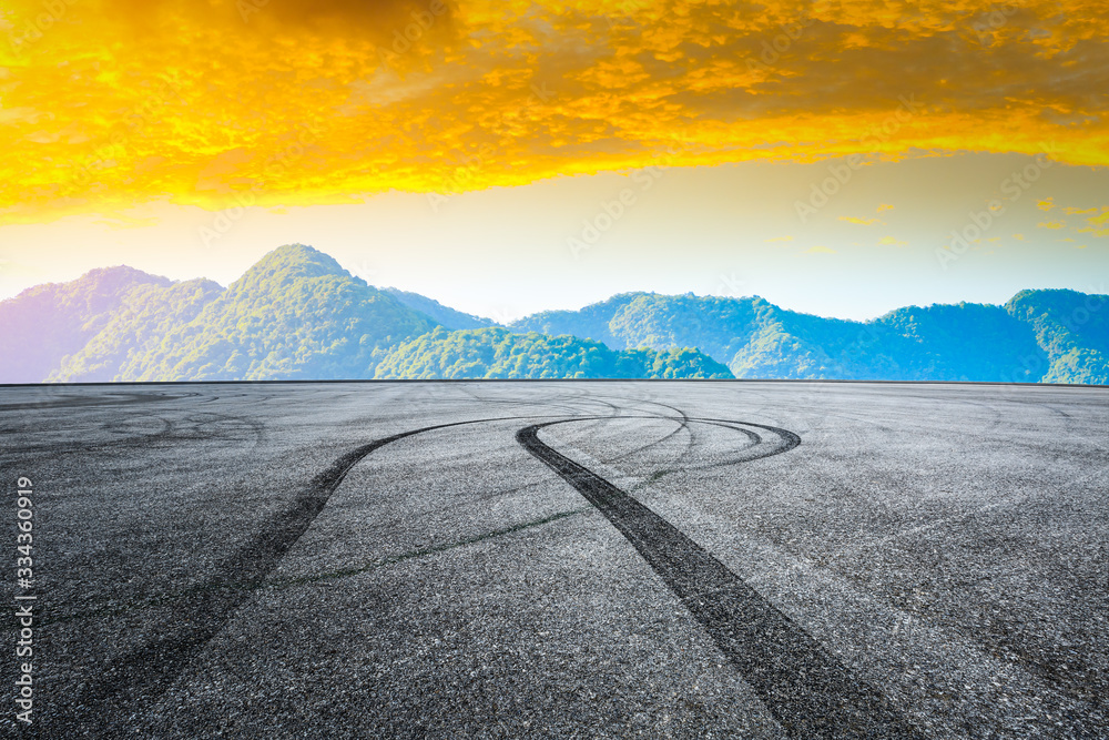 Race track road and green tea plantation nature landscape at sunset.