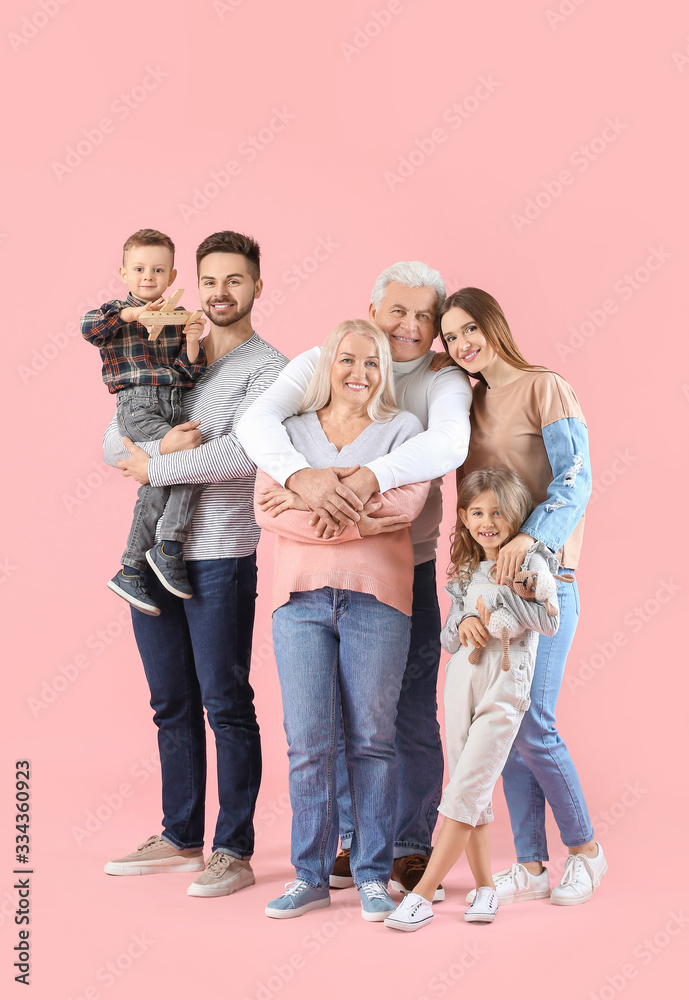 Portrait of big family on color background