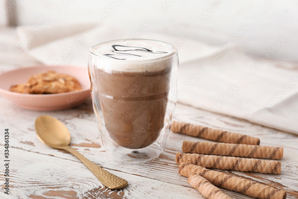 Glass of hot chocolate on table