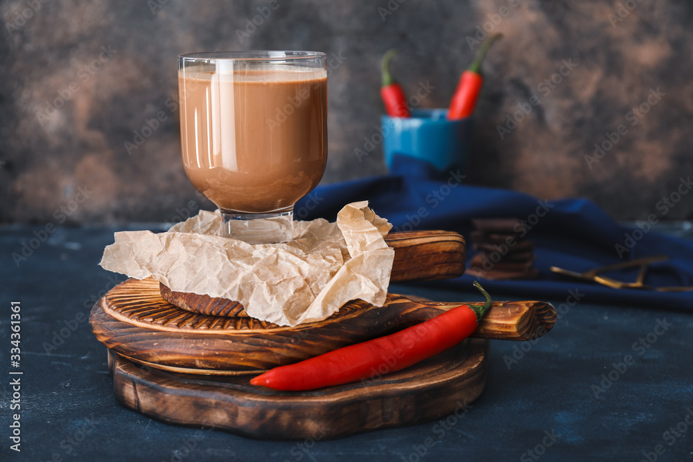 Glass of hot chocolate on table