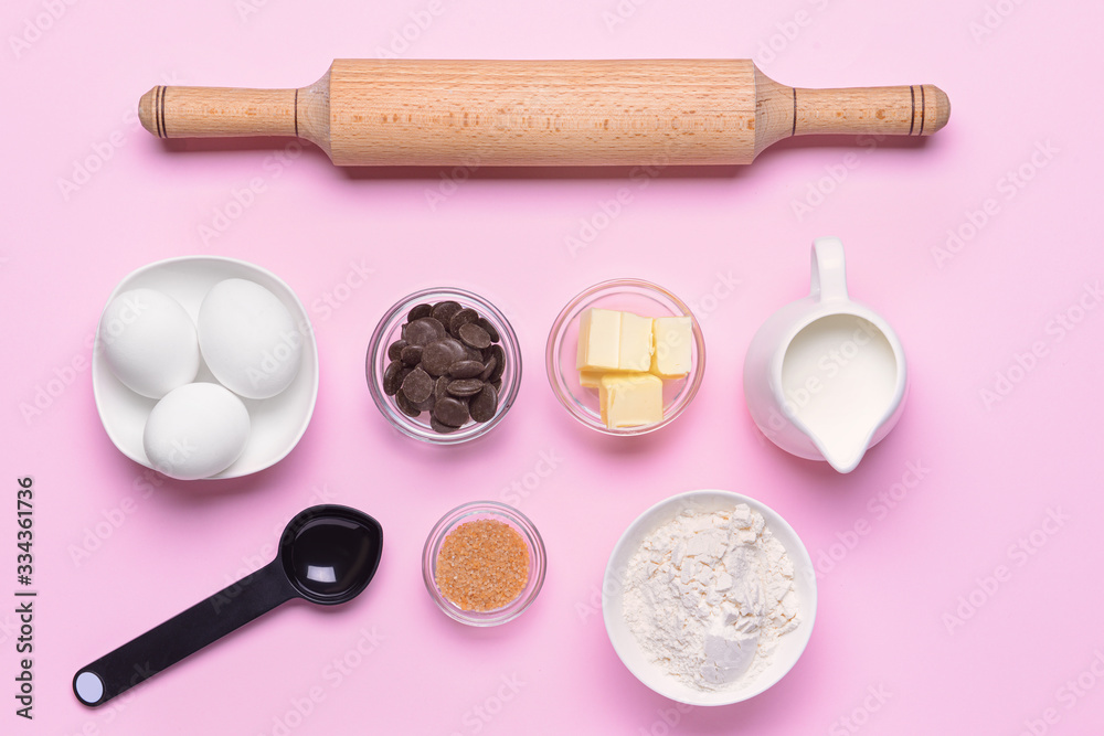 Ingredients for preparing bakery on color background