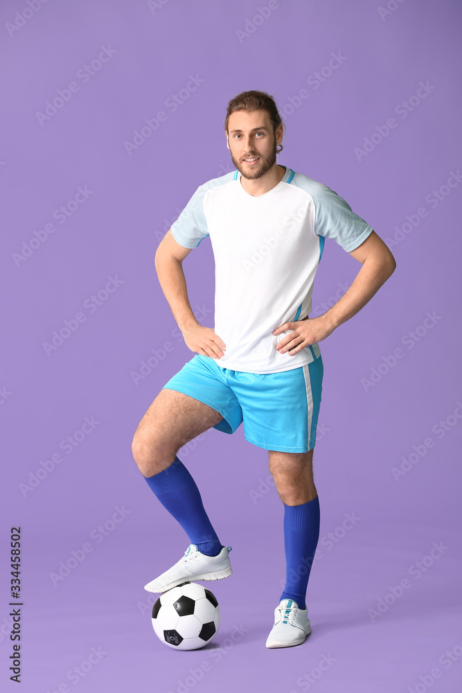 Male football player on color background