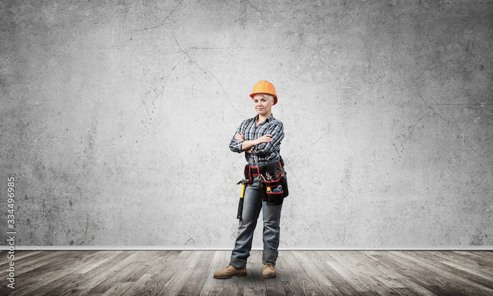 Attractive female engineer in hardhat