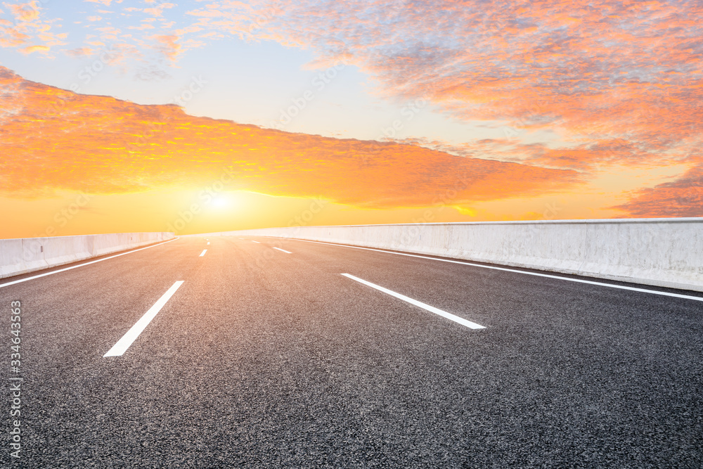 Asphalt highway road and sky sunset clouds landscape.