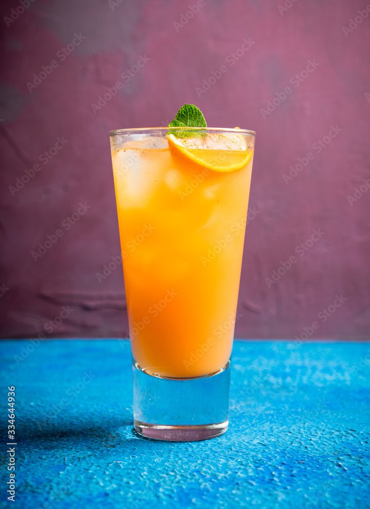 Fresh cocktail with vodka and orange juice on the rustic background. Selective focus. Shallow depth 