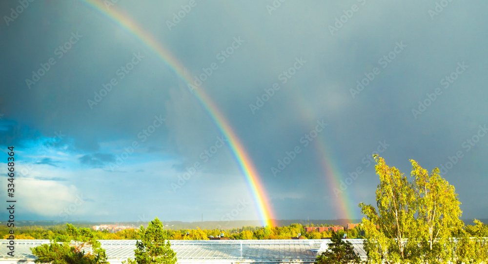 Beautiful rainbow in the clear sky after rain