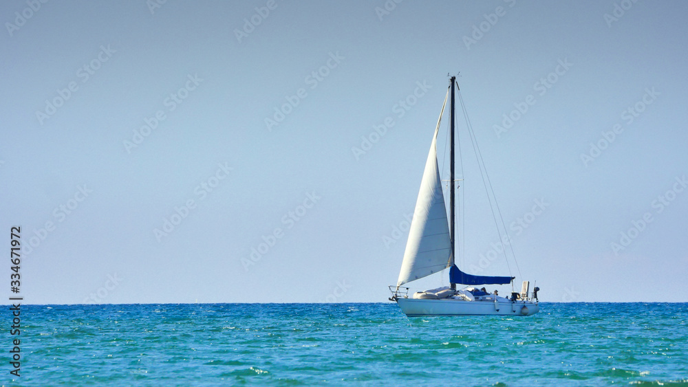 A sailboat in the blue sea