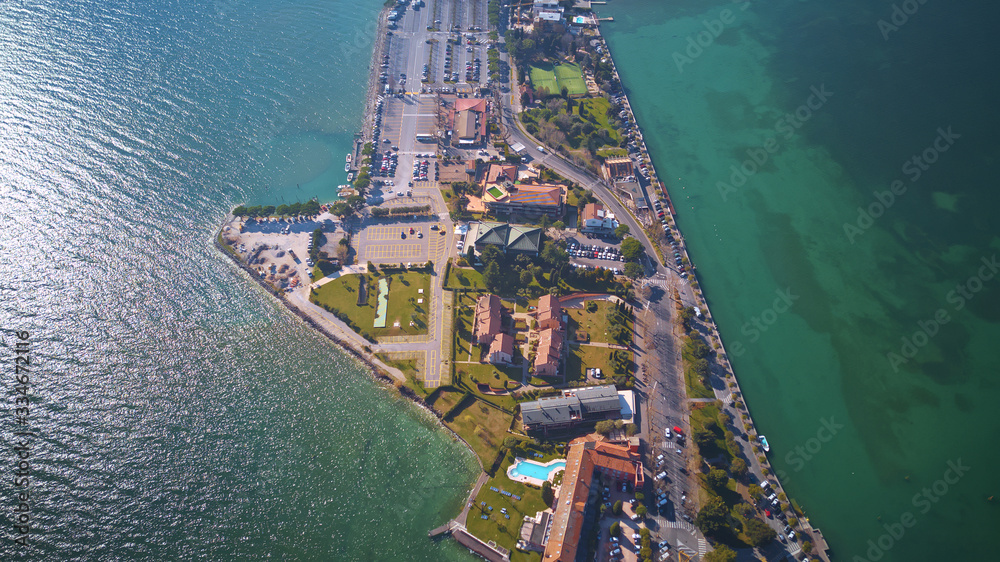 Aerial view of harbor and village houses; beautiful scenery of small town in Sirmione, northern Ital