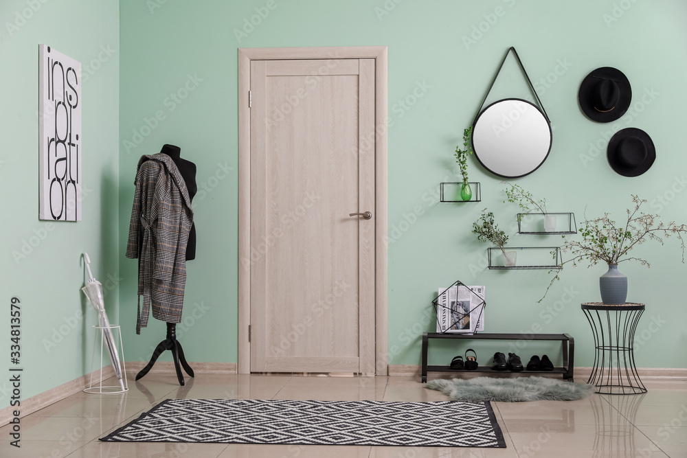 Stylish interior of modern hall with spring flowers