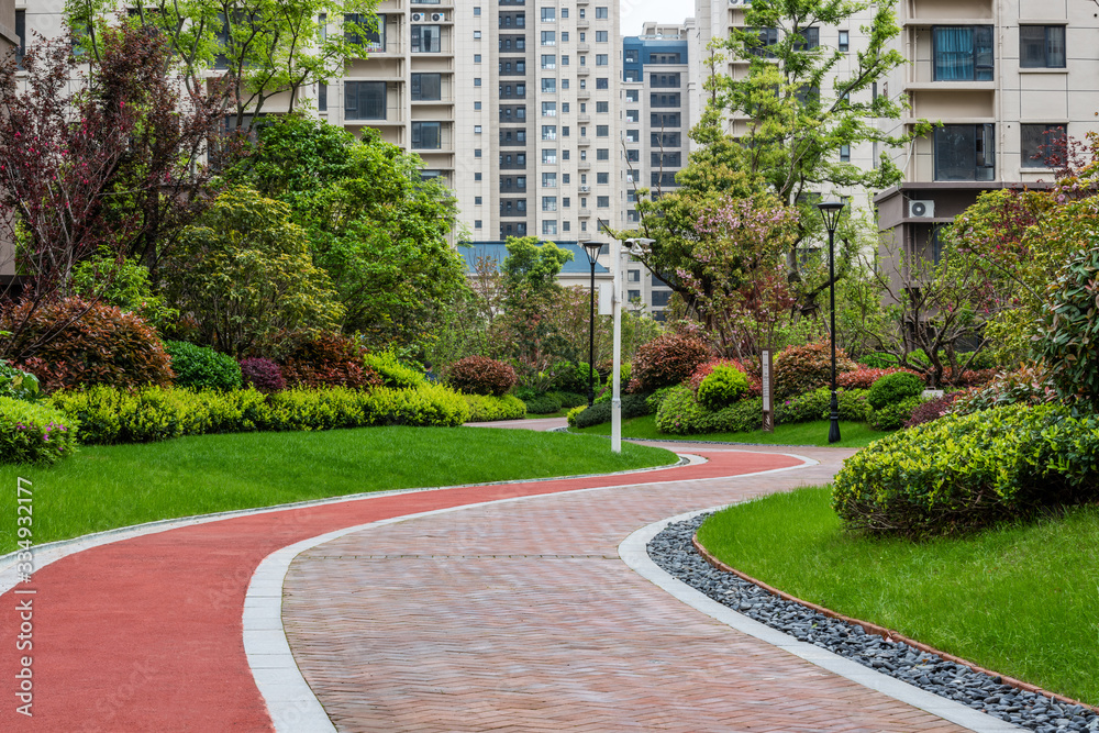 Pathways with green lawns, Landscaping in the garden,Top view of curve walkway on green grass field 