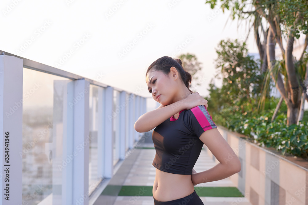 Young girl asian shoulder pain after exercise running and walking.