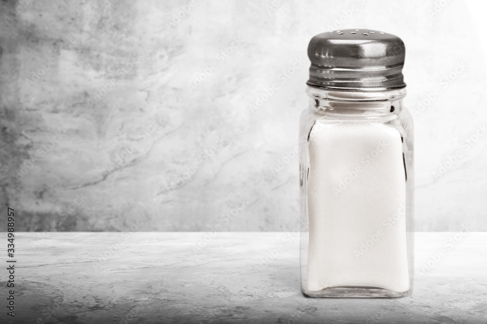 The salt glass bottle on the stone desk