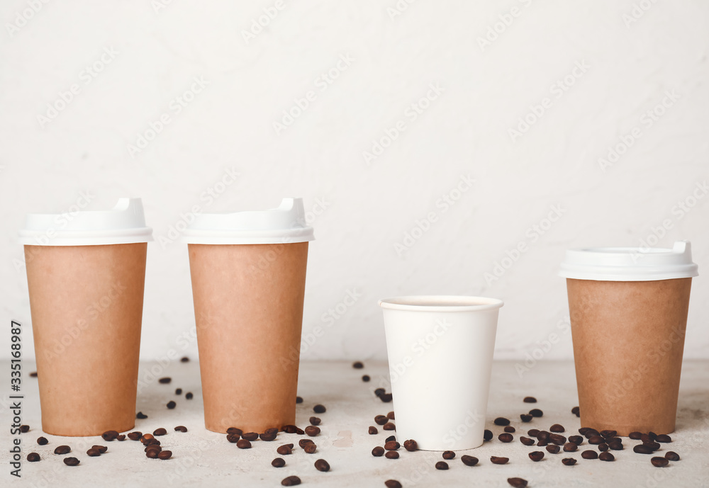 Takeaway coffee cups on table