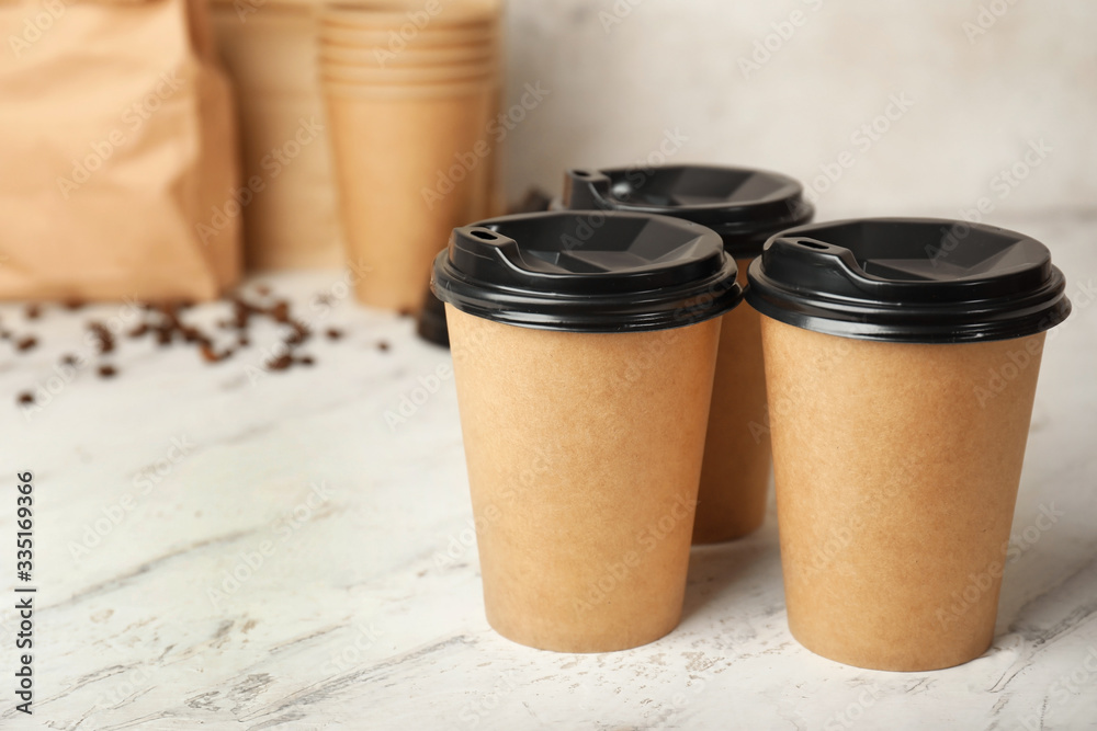 Takeaway coffee cups on table